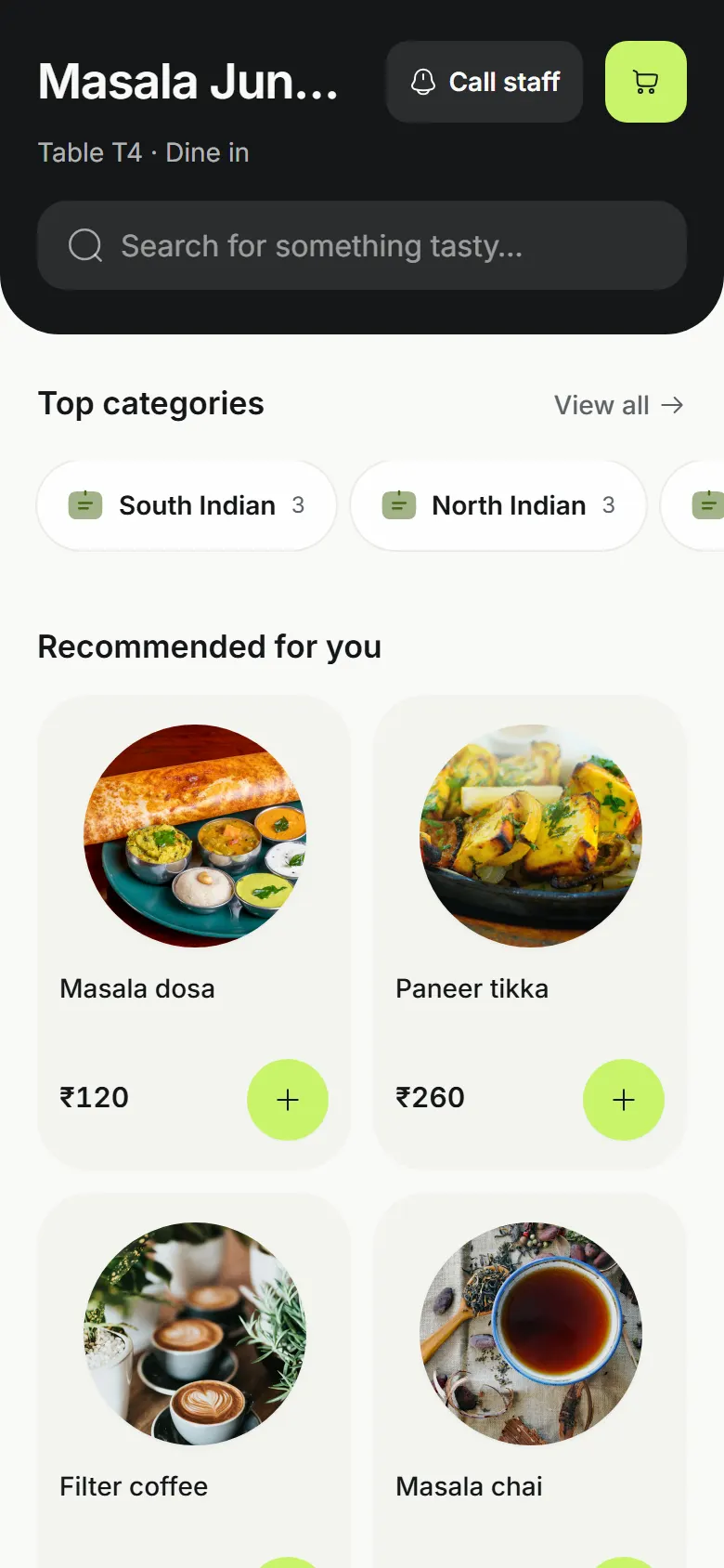 A guest's phone at the table: the restaurant's menu with categories and dishes.